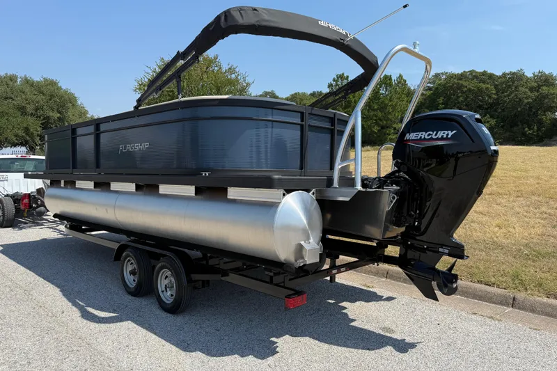 Slide: The Image of 2025 Flagship F22CU SPORT TOON pontoon boat with Mercury engine on trailer. - 14