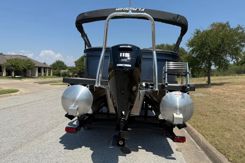 Slide: The Image of 2025 Flagship F22CU SPORT TOON pontoon boat with Mercury 115 engine on a sunny street. - 17