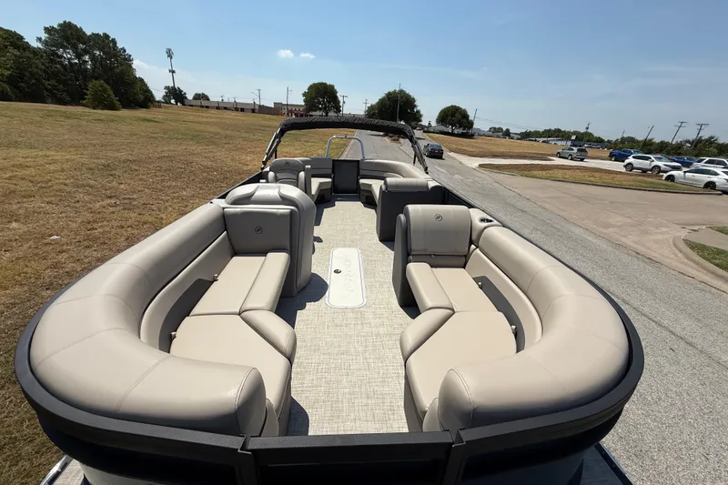 Slide: The Image of Luxurious 2025 Flagship F22CU SPORT TOON pontoon boat with spacious seating and modern design. - 23