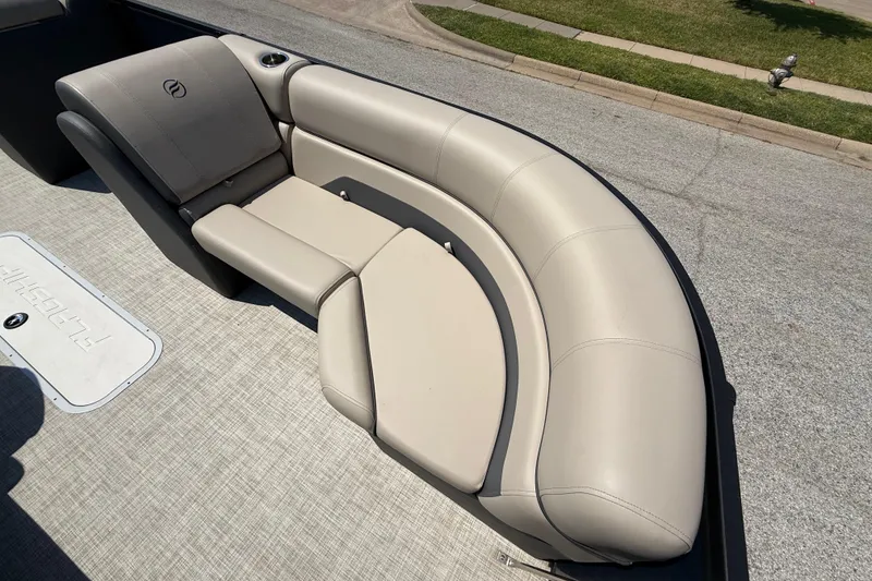 Slide: The Image of Luxurious seating on 2025 Flagship F22CU SPORT TOON boat, featuring beige upholstery. - 26