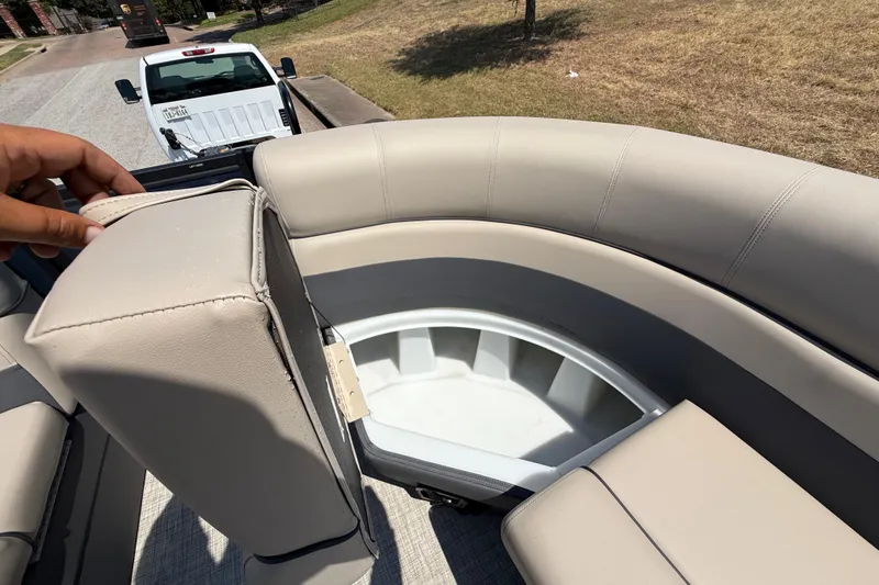 Slide: The Image of 2025 Flagship F22CU SPORT TOON boat with beige seating and storage compartment. - 35