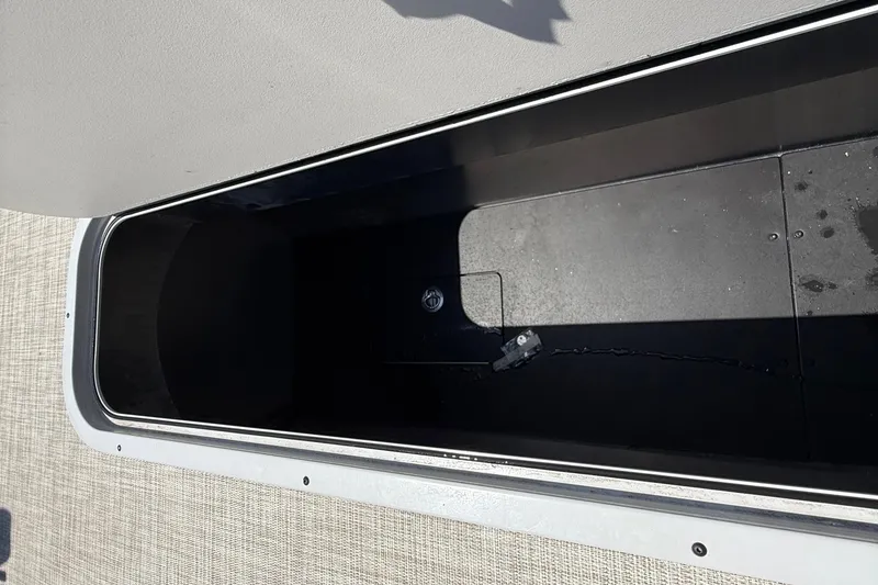 Slide: The Image of Storage compartment of 2025 Flagship F22CU SPORT TOON boat, featuring sleek interior design. - 38