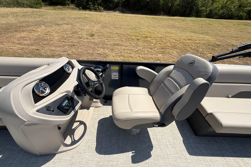 Slide: The Image of 2025 Flagship F22CU SPORT TOON boat interior with steering wheel and comfortable seating. - 42