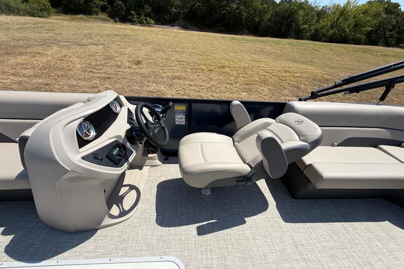 Slide: The Image of 2025 Flagship F22CU SPORT TOON boat interior with steering console and comfortable seating. - 43