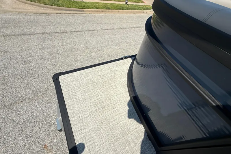 Slide: The Image of 2025 Flagship F22CU SPORT TOON boat on a street, showcasing sleek design and modern features. - 60