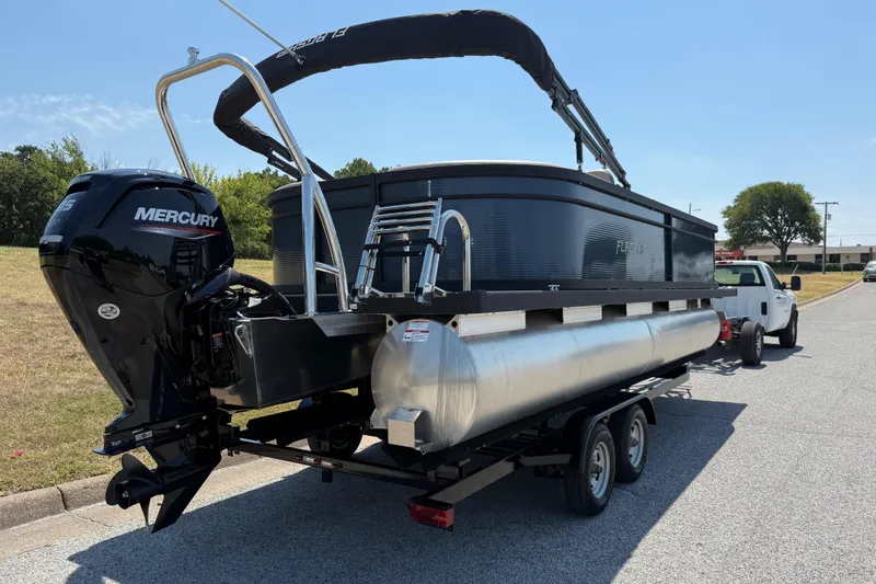 Slide: The Image of 2025 Flagship F22CU SPORT TOON pontoon boat on trailer with Mercury engine. - 74