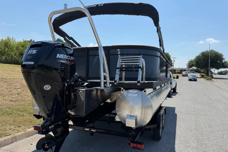 Slide: The Image of 2025 Flagship F22CU SPORT TOON pontoon boat with Mercury 115 engine on trailer. - 75