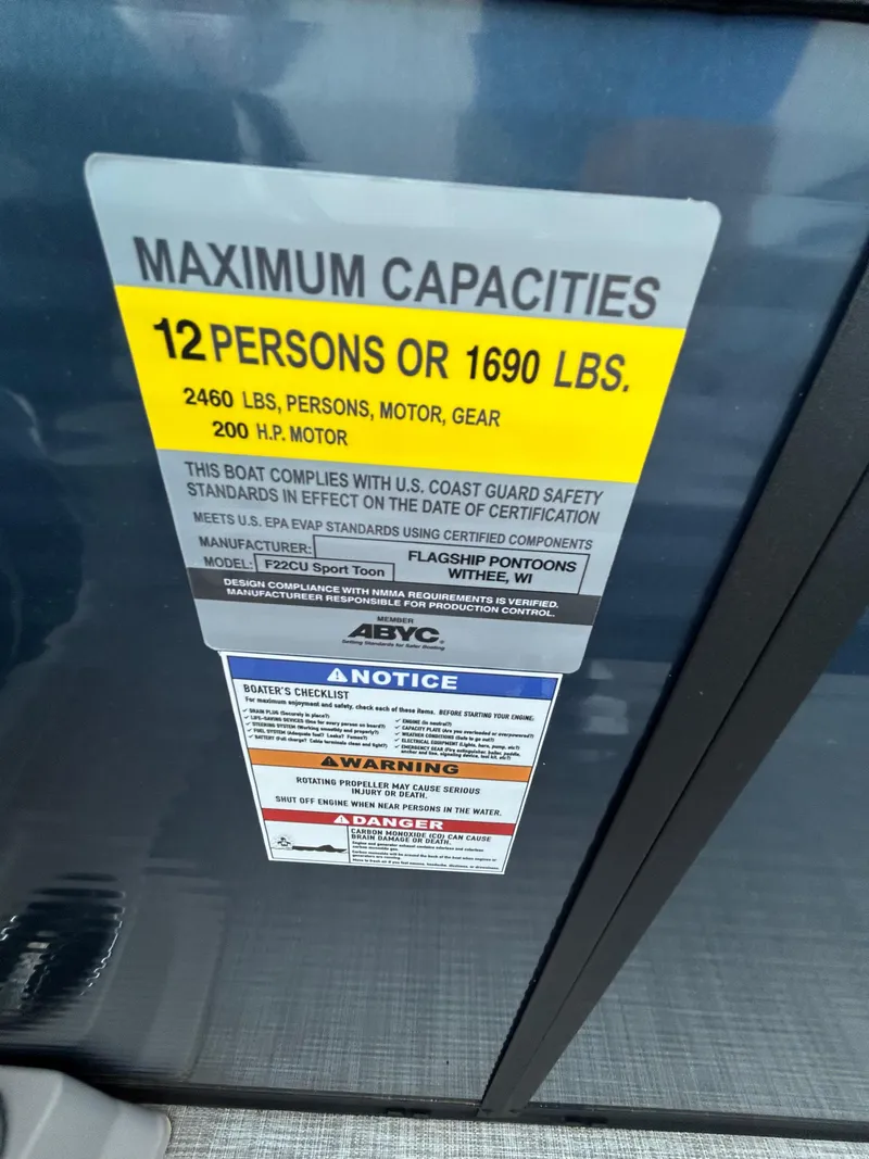 Slide: The Image of Maximum capacity label on Flagship F22CU boat, 2025 model, showing weight and passenger limits. - 79