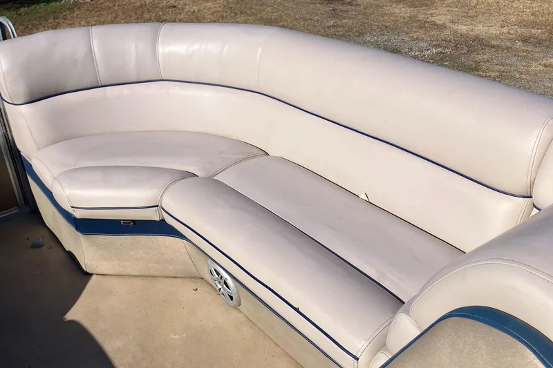 Slide: The Image of Cream leather seating on a 2013 South Bay 724 boat, featuring blue accents. - 5