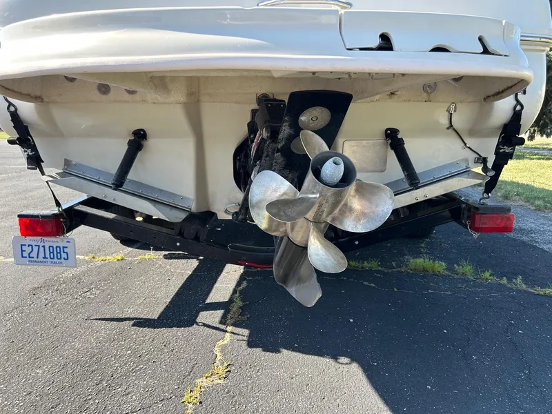 Slide: The Image of Rear view of a 2004 Sea Ray 225 Weekender boat on a trailer. - 6