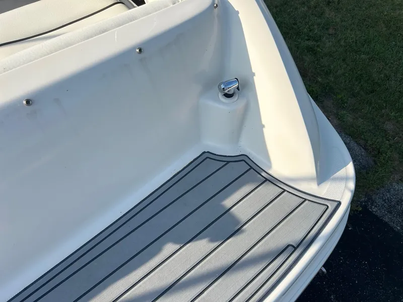 Slide: The Image of 2004 Sea Ray 225 Weekender boat deck with non-slip surface and cleat. - 9
