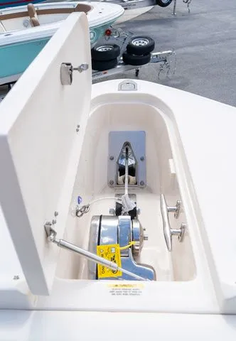 Slide: The Image of 2024 Grady-White Freedom 307 anchor locker with winch and open hatch. - 37