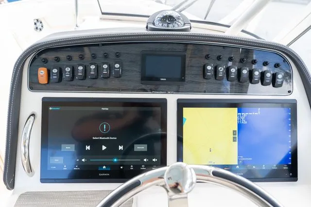 Slide: The Image of 2024 Grady-White Freedom 307 dashboard with advanced navigation and control systems. - 43
