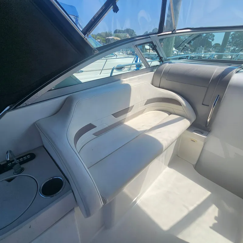Slide: The Image of Interior of a 2000 Formula 31 PC boat, featuring a sleek seating area. - 14