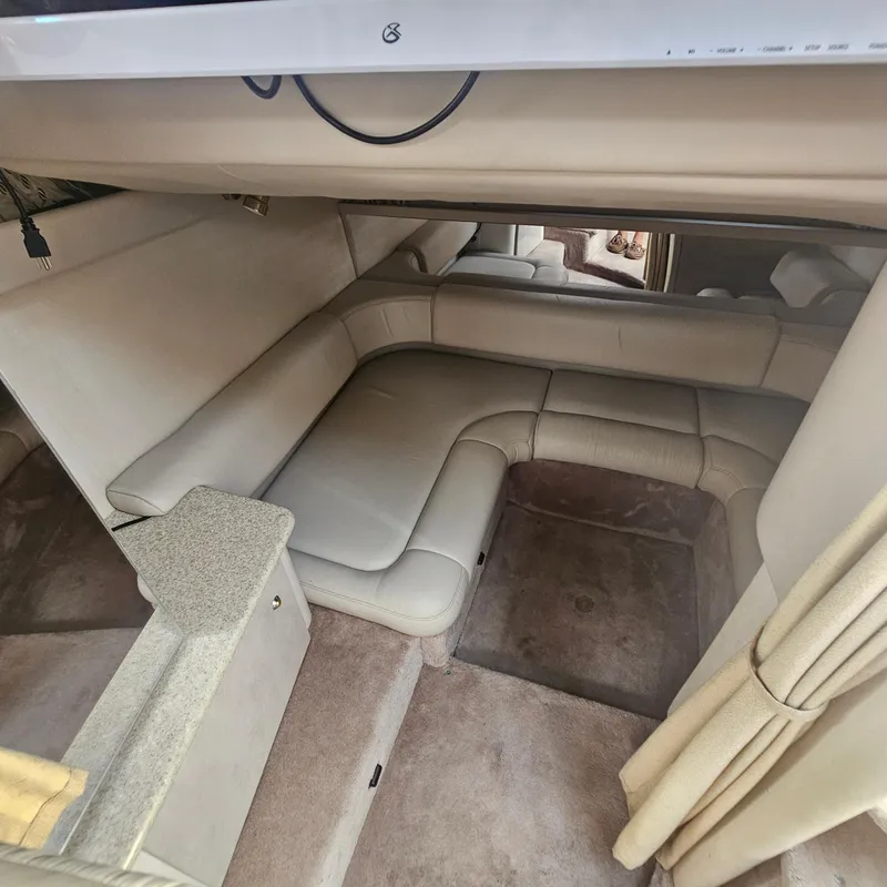 Slide: The Image of Interior of a 2000 Formula 31 PC boat with beige seating and carpet. - 21