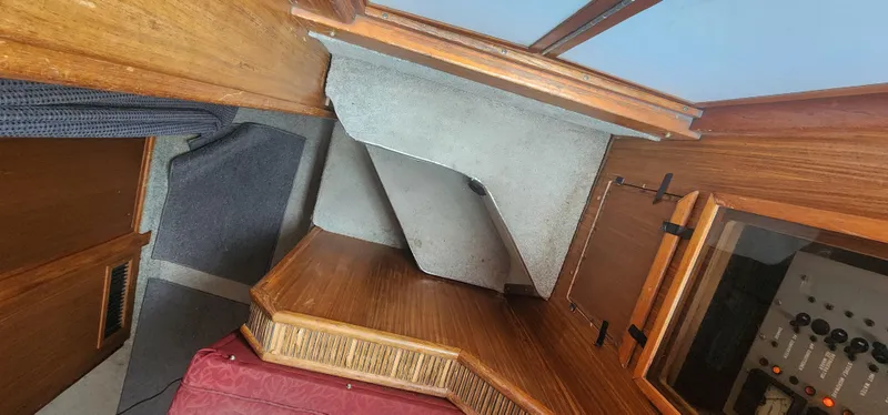 Slide: The Image of Interior view of a 1987 Sea Ray 36 Sundancer, showcasing wood paneling and cabin features. - 11