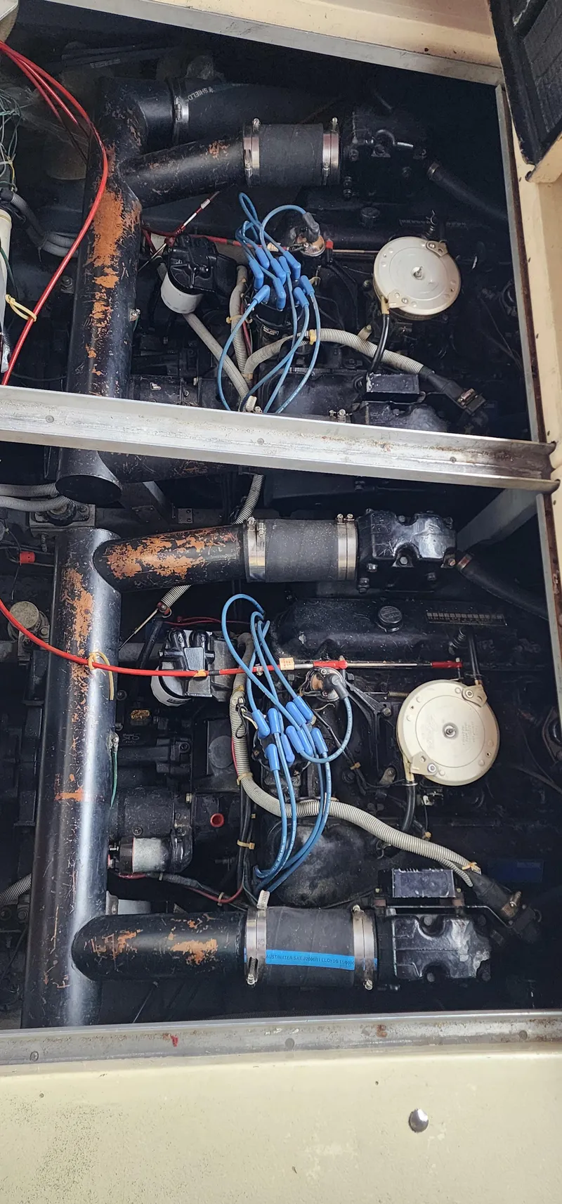 Slide: The Image of Engine compartment of a 1987 Sea Ray 36 Sundancer with visible wiring and components. - 21