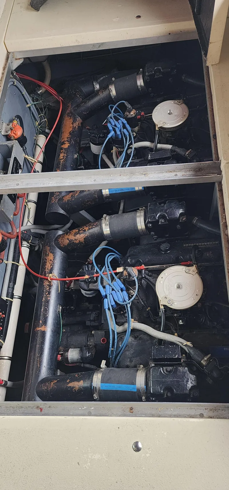 Slide: The Image of Engine compartment of a 1987 Sea Ray 36 Sundancer with visible wiring and components. - 22