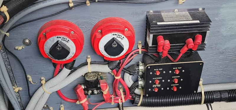 Slide: The Image of Electrical panel of a 1987 Sea Ray 36 Sundancer boat with switches and wiring. - 23