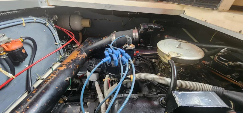 Slide: The Image of Engine compartment of a 1987 Sea Ray 36 Sundancer boat, showing various mechanical components. - 27