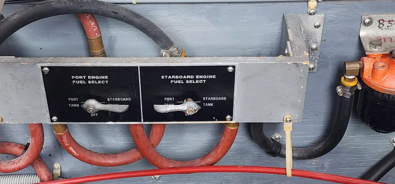 Slide: The Image of Fuel selection panel on a 1987 Sea Ray 36 Sundancer boat with hoses and switches. - 28