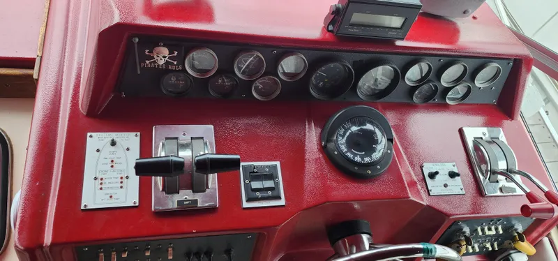 Slide: The Image of Control panel of a 1987 Sea Ray 36 Sundancer boat with gauges and controls. - 4