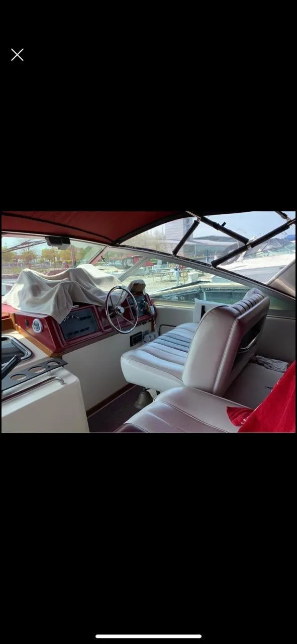 Slide: The Image of 1987 Sea Ray 36 Sundancer boat interior with steering wheel and seating. - 6