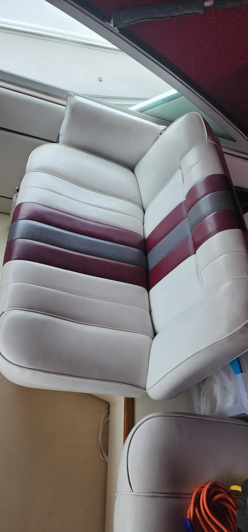 Slide: The Image of White and maroon boat seat in a 1987 Sea Ray 36 Sundancer. - 8