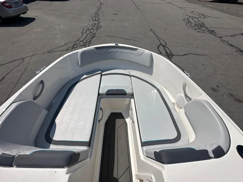 Slide: The Image of 2022 Bayliner Element M17 boat interior with cushioned seating and spacious layout. - 13