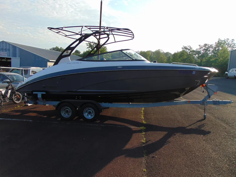 Slide: The Image of 2019 Yamaha Boats 242 Limited S E-Series on trailer, parked outdoors. - 3