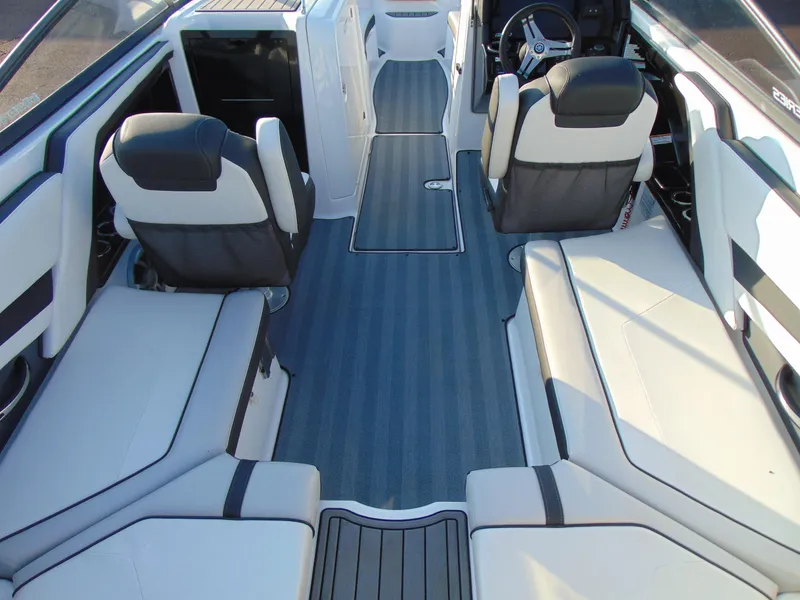 Slide: The Image of 2019 Yamaha Boats 242 Limited S E-Series interior with sleek seating and modern design. - 7
