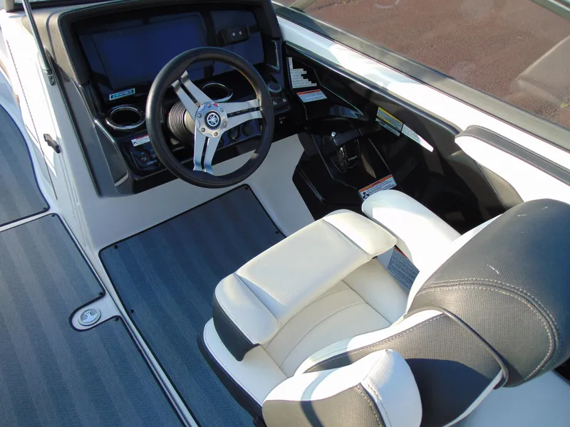 Slide: The Image of 2019 Yamaha Boats 242 Limited S E-Series cockpit with steering wheel and captain's seat. - 9