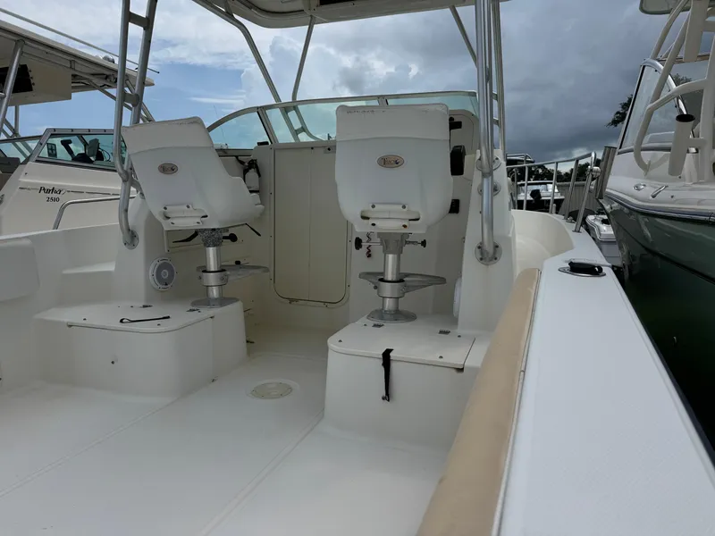 Slide: The Image of 2006 Hydrosport 23wa boat interior with seating and steering area. - 2