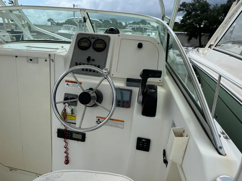 Slide: The Image of 2006 Hydrosport 23wa boat cockpit with steering wheel and control panel. - 3