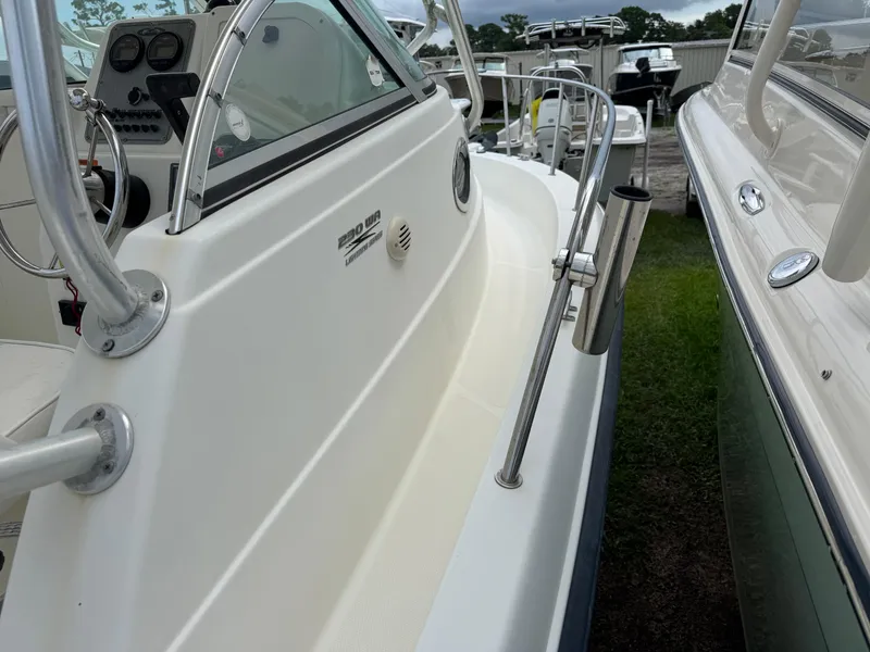 Slide: The Image of 2006 Hydrosport 23wa boat side view, showcasing sleek design and control panel. - 6