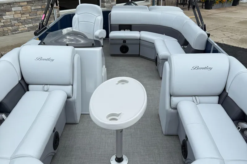 Slide: The Image of 2022 Bentley Pontoons 220CR interior with luxurious seating and table. - 6
