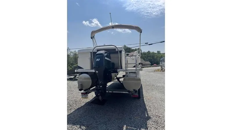 Slide: The Image of 2007 Starcraft Elite 206 RE pontoon boat with Mercury 90 engine on gravel lot. - 6