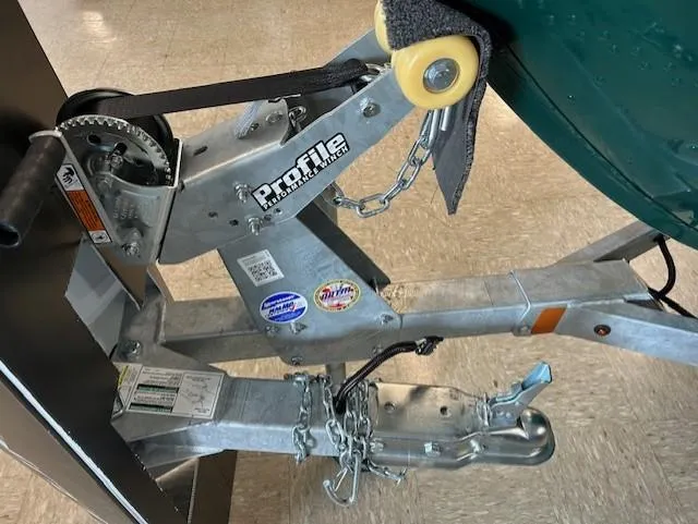 Slide: The Image of Trailer hitch and winch of a 2026 Lund 1650 Angler Sport boat. - 11