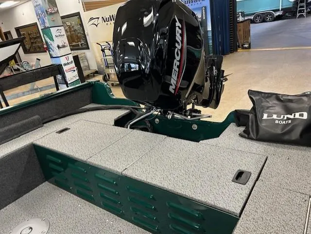 Slide: The Image of 2026 Lund 1650 Angler Sport boat with Mercury engine in showroom. - 6