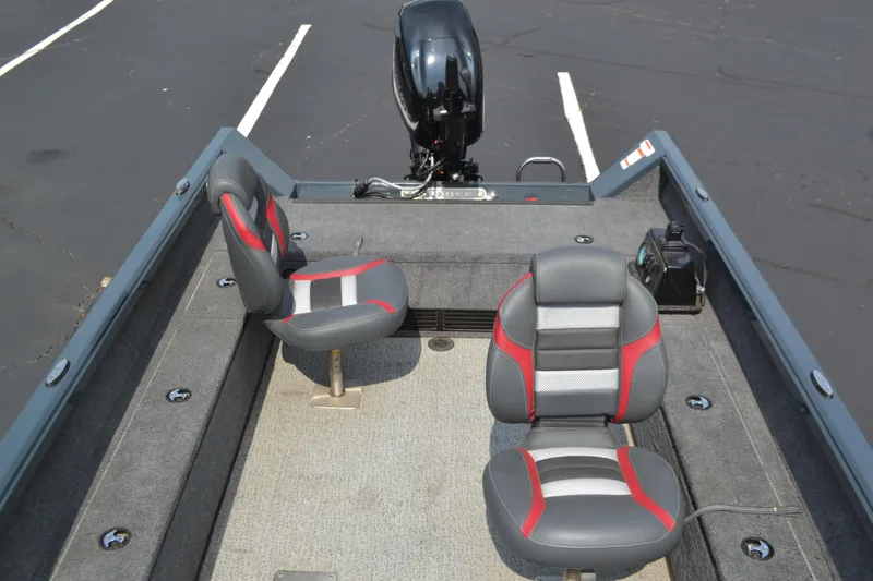 Slide: The Image of 2024 Ranger VS1665T boat interior with two gray and red seats. - 2