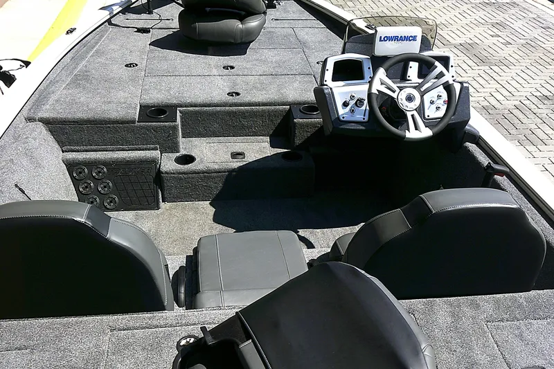 Slide: The Image of 2025 Tracker Pro Team 195 Tournament Edition boat interior with steering console and seating. - 4