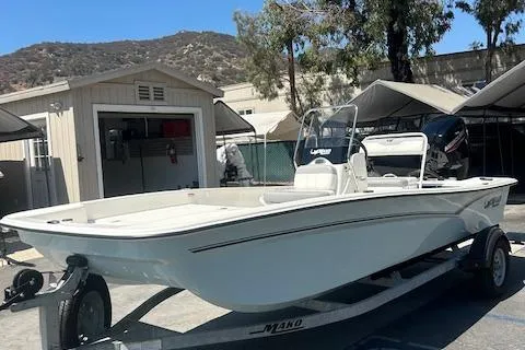 Slide: The Image of 2025 Mako Pro Skiff 17 CC boat with Mercury engine on trailer. - 4