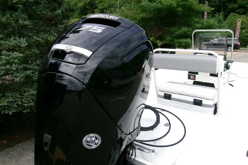 Slide: The Image of 2025 Mako Pro Skiff 17 CC with Mercury 75 engine, parked outdoors. - 4