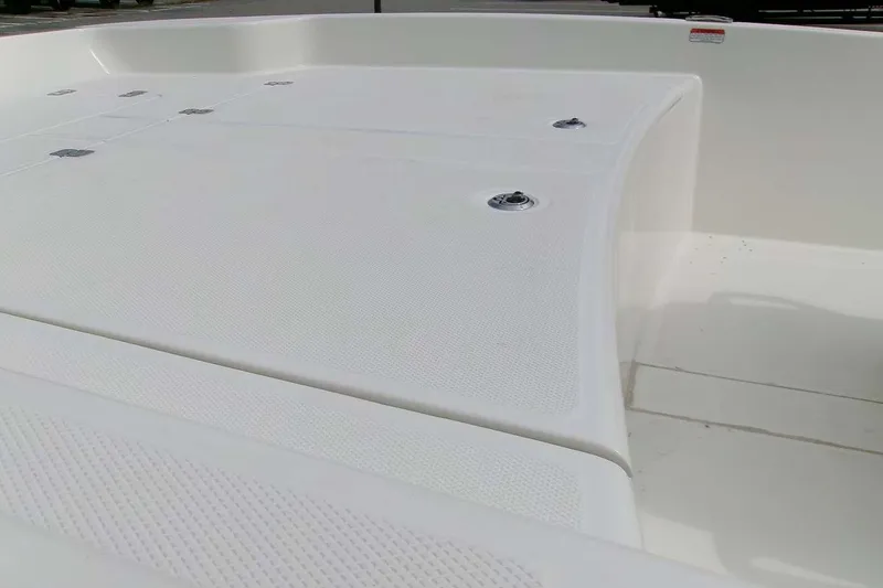Slide: The Image of 2025 Mako Pro Skiff 17 CC boat deck, featuring textured surfaces and storage compartments. - 6
