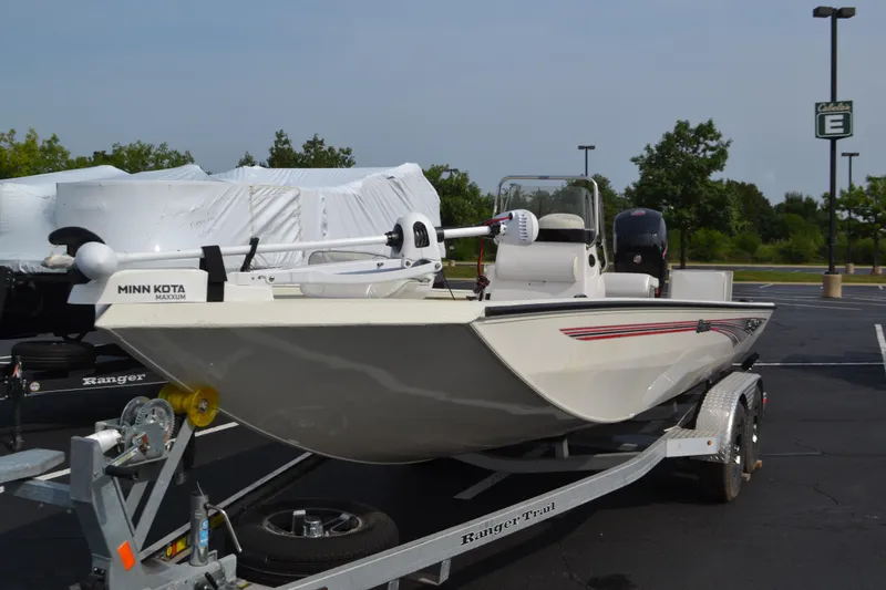 Slide: The Image of 2024 Ranger RB200 boat on trailer in parking lot, featuring Minn Kota Maxxum motor. - 1