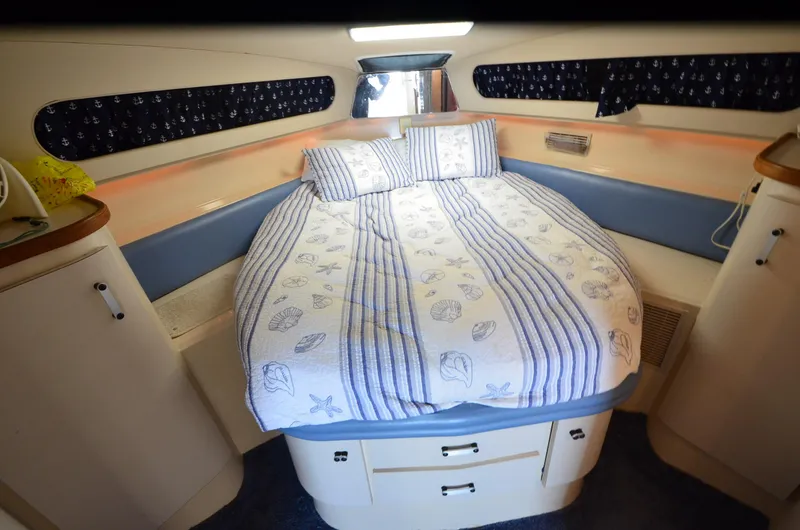 Slide: The Image of 1989 Carver SANTEGO boat cabin with cozy bed and nautical-themed decor. - 27