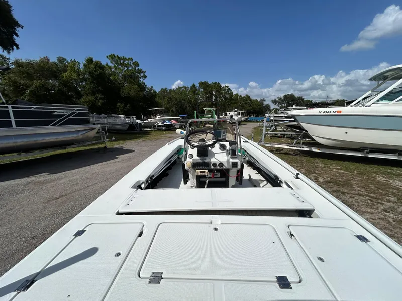 Slide: The Image of 1998 Action Craft 1820 Special Edition boat in a sunny outdoor storage area. - 14