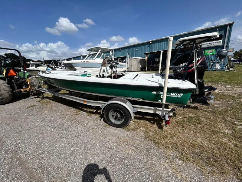 Slide: The Image of 1998 Action Craft 1820 Special Edition boat on trailer, parked outdoors under blue sky. - 2
