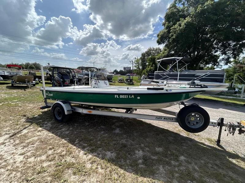 Slide: The Image of 1998 Action Craft 1820 Special Edition boat on trailer under cloudy sky. - 5