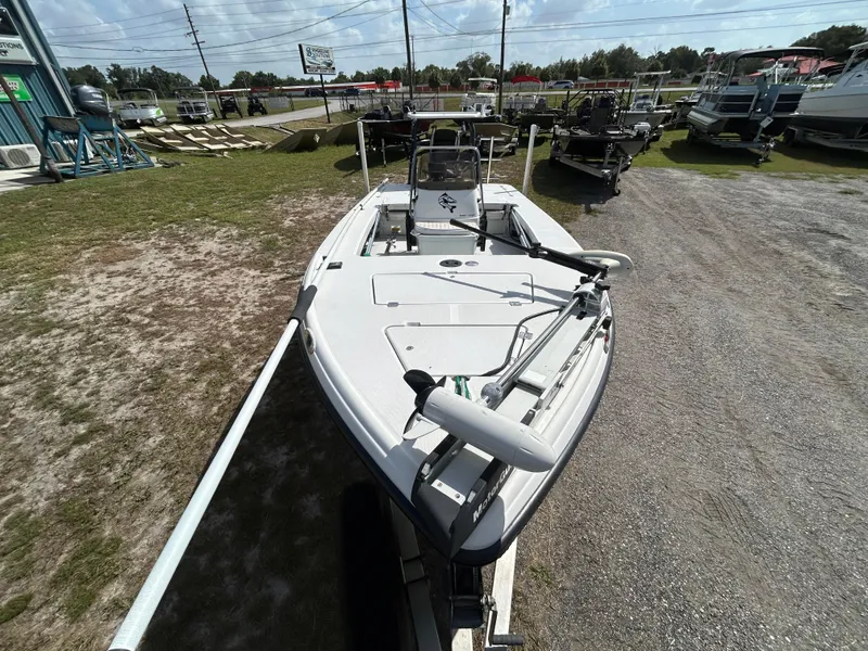 Slide: The Image of 1998 Action Craft 1820 Special Edition boat on display at a dealership. - 6